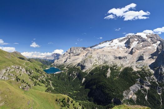 summer view of mount Marmolada and Fedaia lake, Trentino, Italy