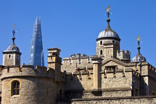 The historic Tower of London with the Shard in the background.