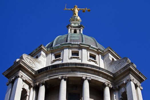 Looking up at the Lady Justice statue ontop of the Old Bailey in London. 