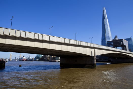 A view taking in London Bridge, The Shard and Tower Bridge in London.