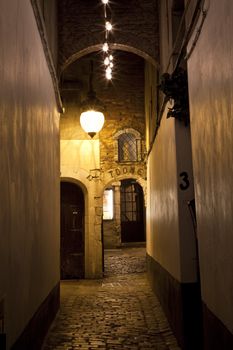 Atmospheric alleyway leading to the Toone Theater in Brussels, Belgium.