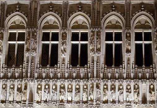 Close-up architectural detail of Brussels City Hall at night.