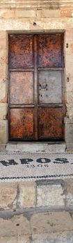 Iconic mansion door in the village of Lindos in Rhodes Greece