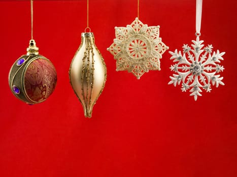 Close-up of christmas bauble against red background.