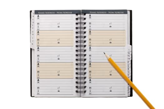 Close up image of organizer notebook and pencil against white background