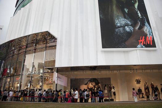 30 September 2012: Kuala Lumpur, Malaysia. Customers on the waiting line to enter the new H&M store opened 22 of September 2012  in Bukit Bintang