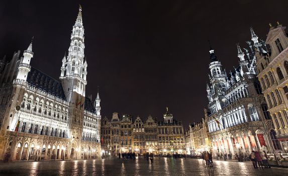 Panoramic view of the impressive Grand Place at night, in Brussels.