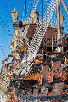 Detail of an historical galleon moored in the port of Genova, Italy