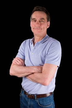 Portrait of Smiling Happy Middle Age Man Arms Folded Black Background