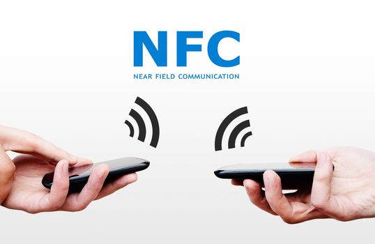 Two mobile phones with NFC payment technology. Near field communication