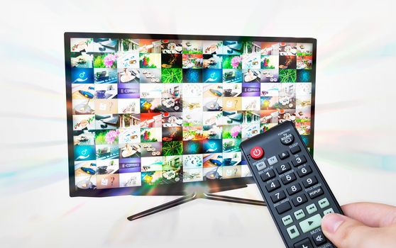 TV with multiple images gallery. Streaming glow effect. Hand hold remote control