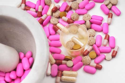 Shot of pink drugs with marble mortar grinding machine