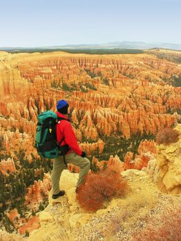 Backpacker resting at Inspiration Point, Bryce Canyon National Park, Utah, USA