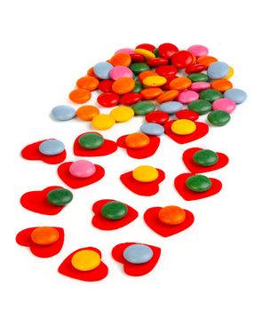 Close up of colorful glazed candies at hearts