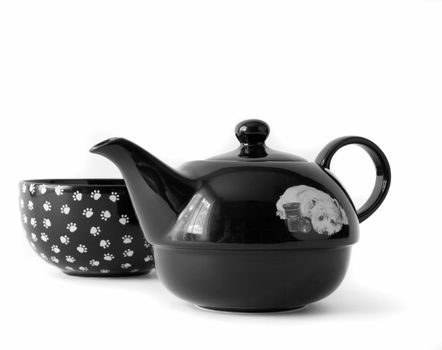 Black cup and teapot isolated on white