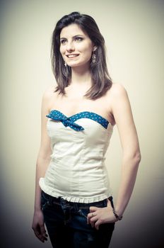 vintage portrait of young woman on vignetting background