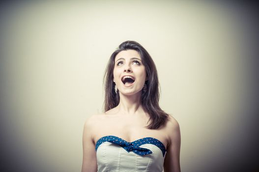 vintage portrait of young woman crying on vignetting background