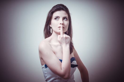 vintage portrait of young woman thinking on vignetting background