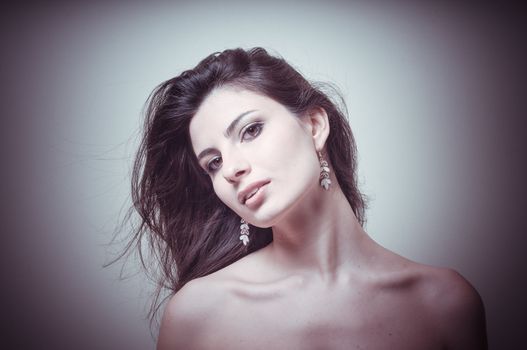 vintage portrait of young woman on vignetting background