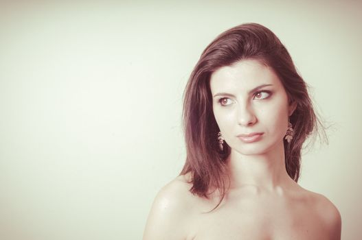 vintage portrait of young woman on vignetting background