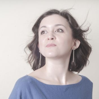 vintage portrait of young woman on vignetting background