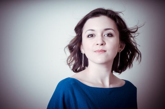 vintage portrait of young woman on vignetting background