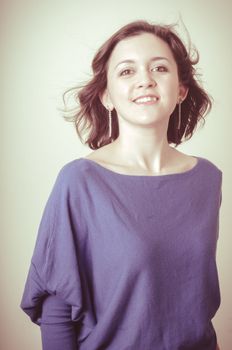 vintage portrait of young woman on vignetting background