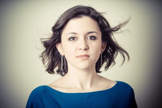 vintage portrait of young woman on vignetting background