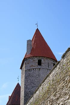 Wall and tower on a background of the blue sky