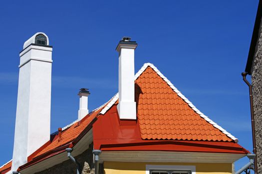 The roof and chimney with blue sky