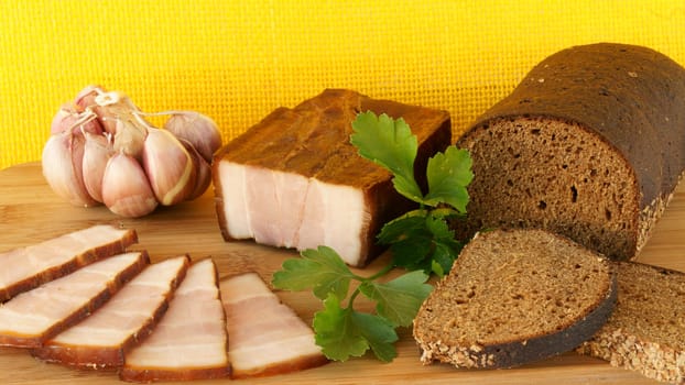 still life with smoked bacon and rye  bread 