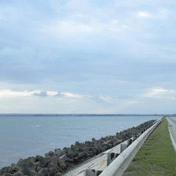 side of highway and blue ocean