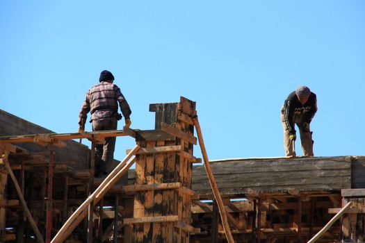 construction of building with woods and cement