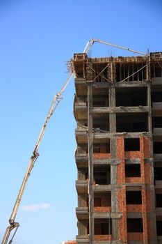 construction of building with cement mixture machine