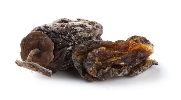 Two isolated dried persimmon on the white background