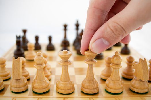 Man playing chess on white background