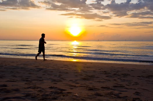 silhouette of man happy on the beach