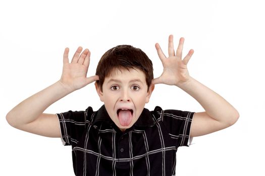 Young boy grimacing isolated on white background