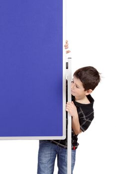 Portrait of happy little boy with blue blank board isolated on white background