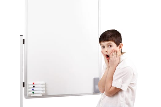 amazed little boy with white blank board isolated on white background