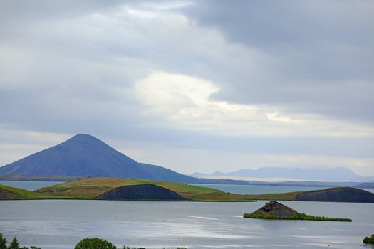 Iceland landscape at summer cloudy day. Mountain lake Myvatn.