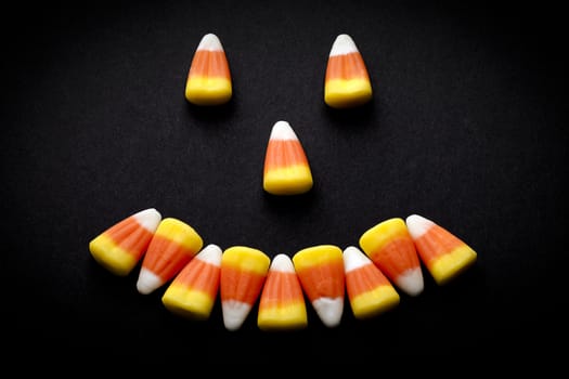 Candy corn forming a happy face.
