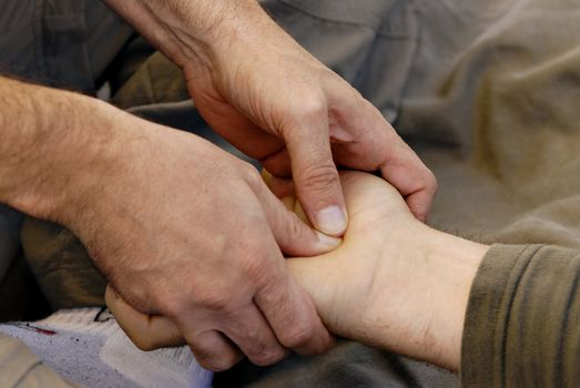 Relaxing hand massage and reflex healing treatment