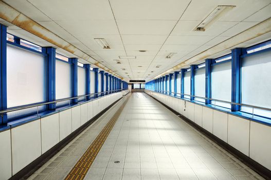 Empty long corridor in the modern office building. 