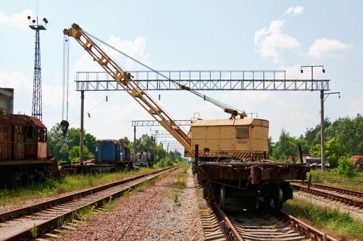 Old Rail Track Mounted Crane with blue sky on background