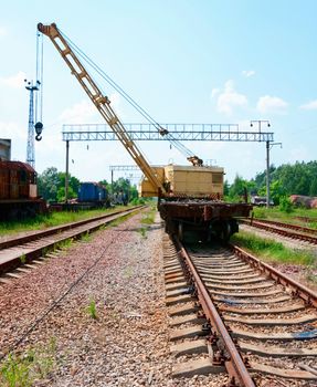 Old Rail Track Mounted Crane with blue sky on background