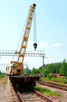 Old Rail Track Mounted Crane with blue sky on background