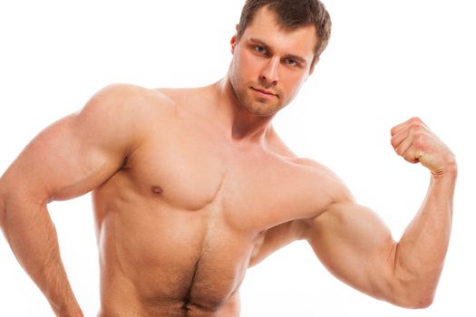 Young handsome bodybuilder isolated over white background