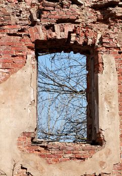 bare window aperture of a ruined house