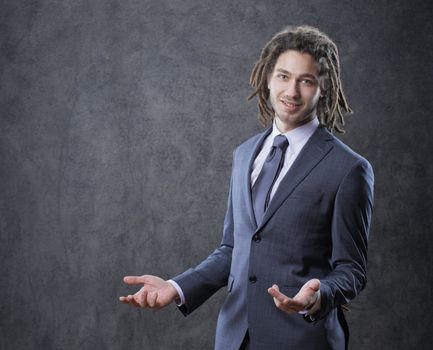 Portrait of positive well-dressed businessman